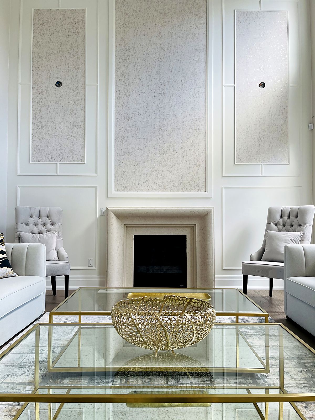 Luxury living room finished by ProRollers with painted panelling, wallpaper inserts and a stone fireplace